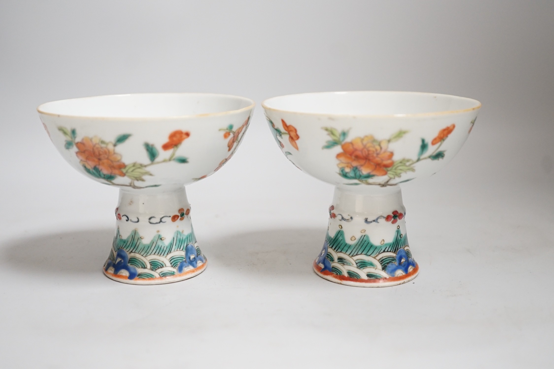 A pair of 19th century Chinese stem cups with four flower design, 9cm